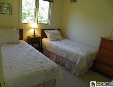 Second bedroom with two twin beds.