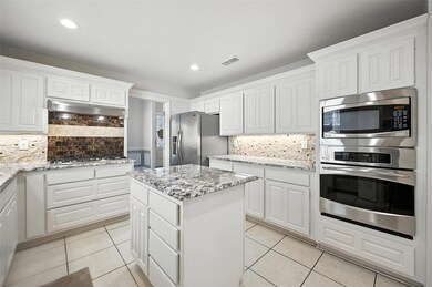 Kitchen with Island and stainless steel appliances