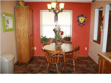 Bay window with seat in dining area. Updated light