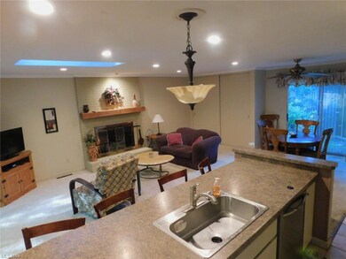 Family room has gas fireplace and dining area.