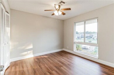 Unfurnished bedroom featuring ceiling fan, a close