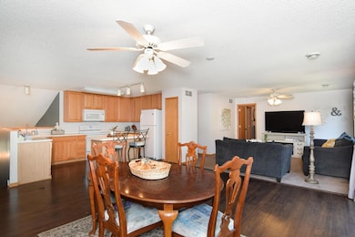Updated engineered wood floors flow from dining room to kitchen!