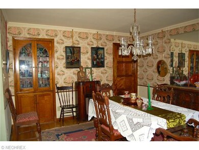 The wallpaper in the DR is in fantastic shape, it is original from 1930's....More great woodwork, with a built-in leaded glass china cabinet and 8 panel door to kitchen.
