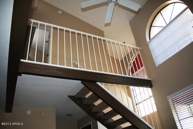 Living Room with Balcony and Stairs