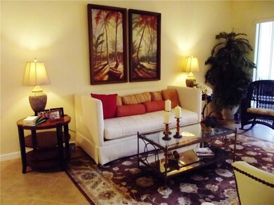 Living room leads to patio with preserve views.