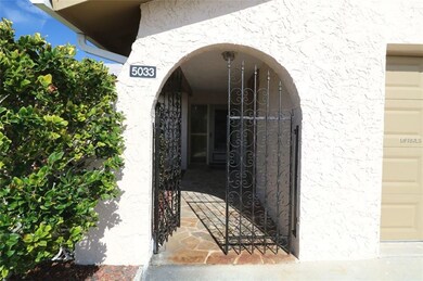 Nice covered entryway with patio to left.