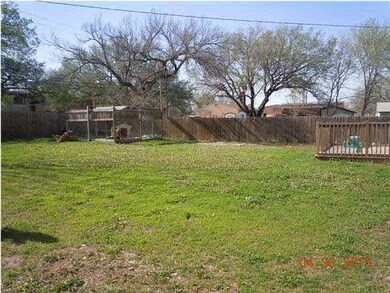 ONE VIEW OF BACKYARD. DOG KENNEL STAYS!