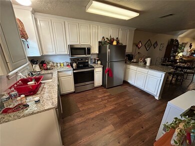 Kitchen featuring appliances with stainless steel