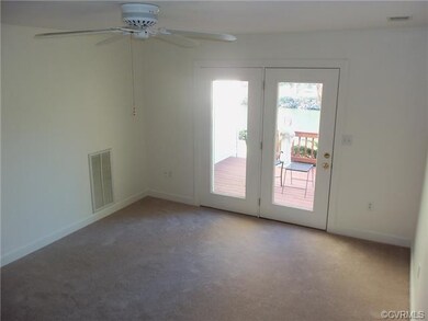 Living Room Opens to Deck Overlooking the Lake