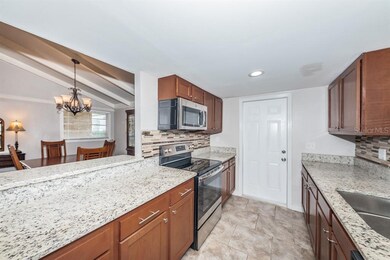 Kitchen overlooks the dining room, dinette and gre
