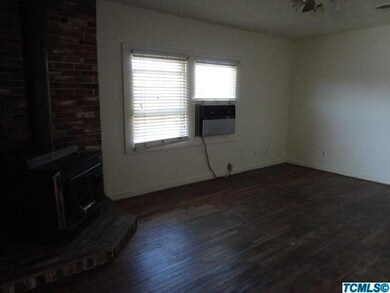 Living room with hardwood floors and woo
