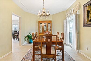 Dining room with plantation blinds and easy access to kitchen!