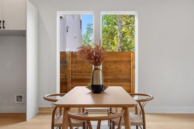 Dining space with light wood-type flooring and baseboards