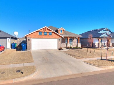 View of front of home featuring a garage and cover