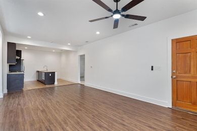 Unfurnished living room with recessed lighting, w