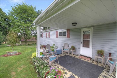 Cozy covered rear patio beckons you to relax with