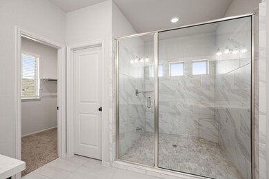 Full bathroom featuring a shower stall