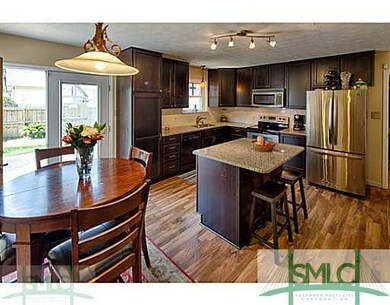 Kitchen. Spacious kitchen opens to large deck in b