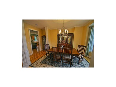 Dining room with hardwood floors and bay window