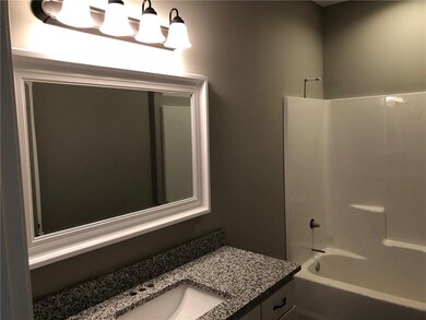 Large second bathroom with granite counter tops.