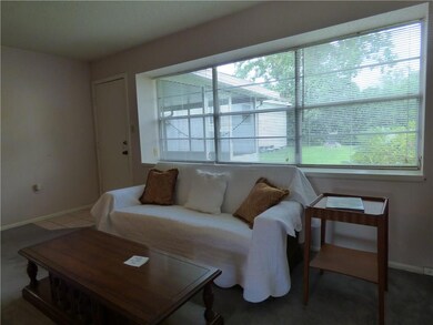 Den/family room with view of screened patio
