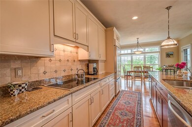 The kitchen has high end cabinetry and appliances 