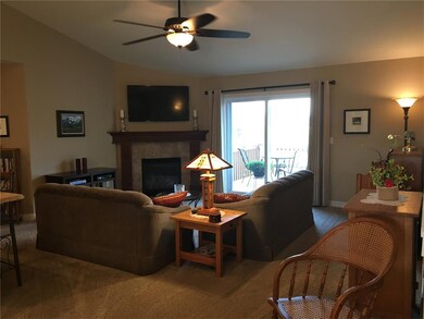 Great room with gas fireplace, sliders to deck and