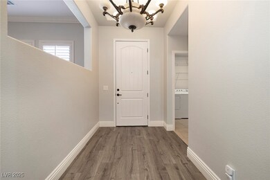 Doorway with baseboards, wood finished floors, was