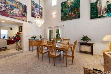 Spacious dining area with view of family kitchen i