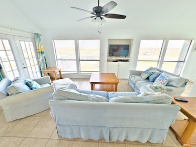 The French doors lead to the large deck