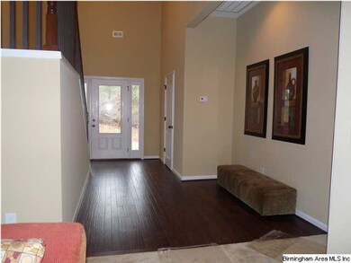 Dramatic 2 story foyer w gorgeous hardwoods and re