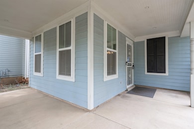 View of exterior entry with a porch
