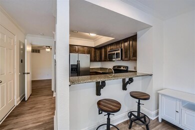 Kitchen with dark wood-type flooring, ceiling fan,