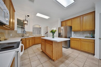 Kitchen island has room for a bar stool or two!
