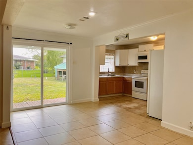 View into back yard and open kitchen.