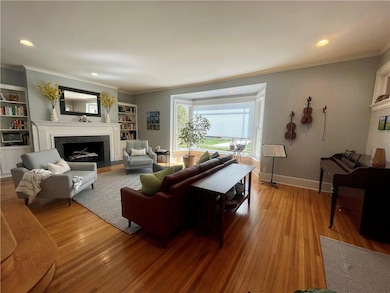 Formal living room with wood burning fireplace.