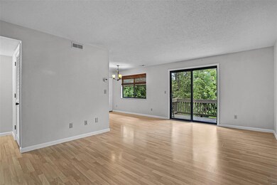 Large open floor plan with a sliding door leading onto the balcony.