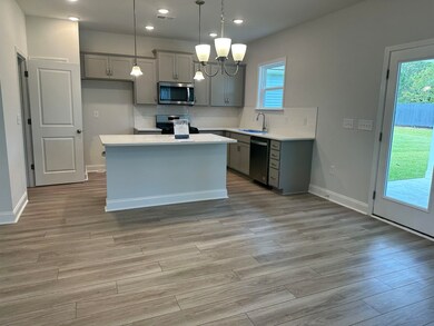 Kitchen with appliances with stainless steel finis