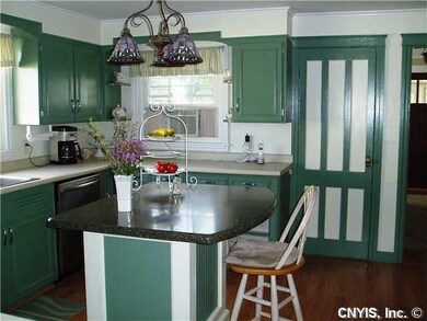 Kitchen. Nice island/breakfast bar. The door leads