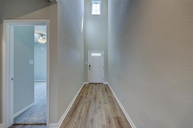 Doorway to outside with light wood-style flooring