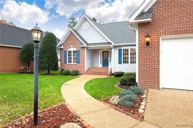 Front facade with a garage and a front lawn