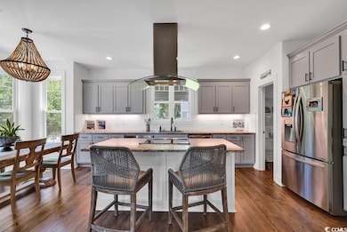 Kitchen with island range hood, stainless steel fr