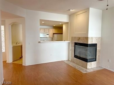 Unfurnished living room with wood finished floors,