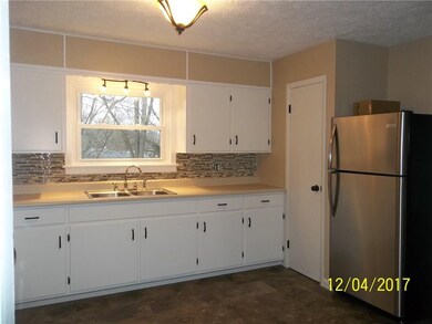 Kitchen overlooks back yard