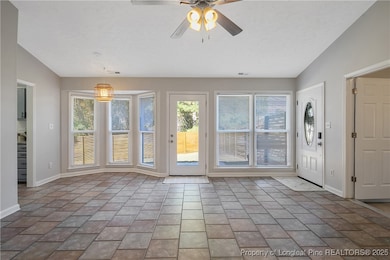 DINING SPACE AND DOOR LEADING TO PATIO