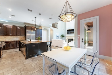 Perspective of the kitchen from the breakfast room which boasts access to the patio.