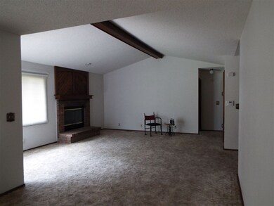 Living room view, fireplace, bright and cheerful!
