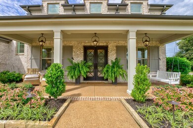View of exterior entry featuring a porch