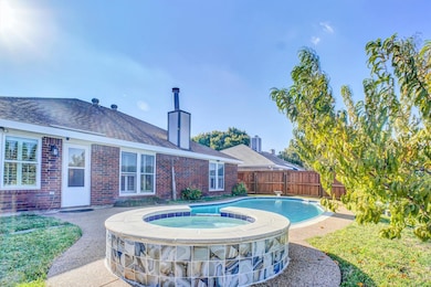 View of pool featuring a patio and a pool with connected hot tub
