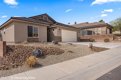 Ranch-style house featuring a garage, stucco sidin
